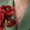 ROBERTO-COIN-PRINCESS-FLOWER-18KT-ROSE-GOLD-FLOWER-PENDANT-WITH-DIAMONDS-MEDIUM-VERSION-ADR777CL0680_WEAR-1